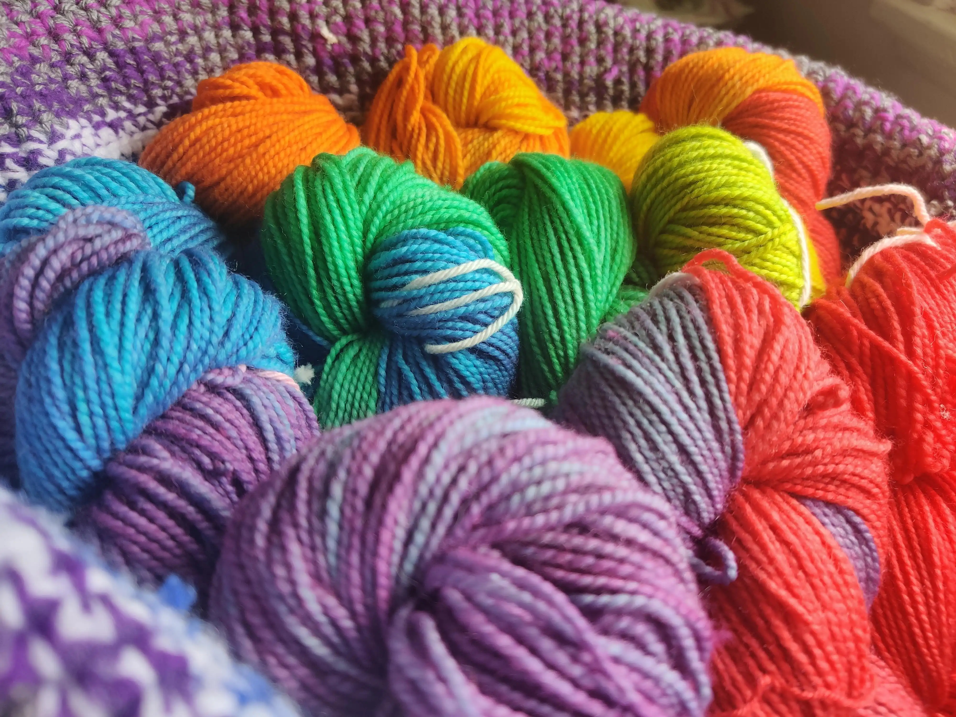 Skeins of hand-dyed yarn in bright, saturated colors